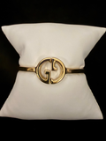 GG Gold Tone Bangle
